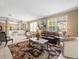 Open concept living room features tile floors, neutral colors, and comfortable seating arrangements at 7606 Berna Ln, Land O Lakes, FL 34637