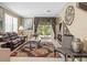 Inviting living room with tile floors, comfortable seating, and natural light from the sliding doors at 7606 Berna Ln, Land O Lakes, FL 34637