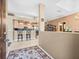Open-concept living space showcasing a kitchen with bar seating and adjacent dining area, creating a welcoming atmosphere at 7606 Berna Ln, Land O Lakes, FL 34637