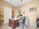 Functional home office with a desk and cozy seating area, perfect for remote work at 7606 Berna Ln, Land O Lakes, FL 34637