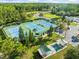 A lively aerial shot of community tennis courts and recreation area at 7606 Berna Ln, Land O Lakes, FL 34637