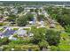 Aerial view of a charming home nestled in a serene neighborhood with lush greenery at 7704 Tanglewood Ln, Tampa, FL 33615