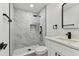 Modern bathroom features rainfall shower, sleek black fixtures, and stylish vanity at 7704 Tanglewood Ln, Tampa, FL 33615