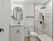 Modern bathroom featuring elegant tile shower, updated vanity and fixtures at 7704 Tanglewood Ln, Tampa, FL 33615
