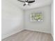 Neutral bedroom features modern ceiling fan and vinyl flooring at 7704 Tanglewood Ln, Tampa, FL 33615