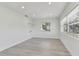 Bright living room features recessed lighting, light wood floors, and a window for natural light at 7704 Tanglewood Ln, Tampa, FL 33615