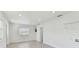 Bright living room features recessed lighting, light wood floors, and a window for natural light at 7704 Tanglewood Ln, Tampa, FL 33615