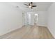 Large bedroom featuring doorways to bathroom and a walk-in closet at 7704 Tanglewood Ln, Tampa, FL 33615