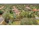 An aerial view showcasing the private backyard pool and lush landscaping of this stunning luxury home at 7803 Mathern Ct, Lakewood Ranch, FL 34202