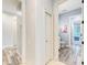 Hallway view of a half-bath with modern fixtures and wood-style tile flooring at 7803 Mathern Ct, Lakewood Ranch, FL 34202