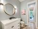 Bathroom with updated sink and fixtures and a view to the outdoor living space at 7803 Mathern Ct, Lakewood Ranch, FL 34202