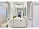 Bathroom featuring updated vanity with double mirrors and updated fixtures and lighting at 7803 Mathern Ct, Lakewood Ranch, FL 34202