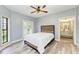 Bedroom with a view to a bathroom and a door to a deck at 7803 Mathern Ct, Lakewood Ranch, FL 34202