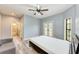 Spacious bedroom with french doors leading to a balcony and en suite bath at 7803 Mathern Ct, Lakewood Ranch, FL 34202