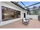Beautiful covered deck with stylish chairs, a seating area, and a clear view of the outdoors at 7803 Mathern Ct, Lakewood Ranch, FL 34202