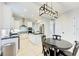 Bright kitchen featuring a center island, modern lighting, and stainless steel appliances at 7803 Mathern Ct, Lakewood Ranch, FL 34202