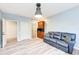Living room with wood floors, a sofa, and a wet bar at 7803 Mathern Ct, Lakewood Ranch, FL 34202