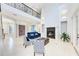 Bright, expansive living room with a soaring ceiling, fireplace, and elegant decor at 7803 Mathern Ct, Lakewood Ranch, FL 34202