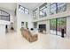 Bright living room with soaring ceilings and expansive windows leading to outdoor area at 7803 Mathern Ct, Lakewood Ranch, FL 34202