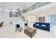 Stunning open-concept space with a grand staircase, soaring ceilings, and natural light at 7803 Mathern Ct, Lakewood Ranch, FL 34202