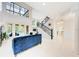 Bright living space features high ceilings, clerestory windows, staircase, and access to the outdoor pool area at 7803 Mathern Ct, Lakewood Ranch, FL 34202