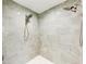 This luxury tiled shower stall features dual shower heads and modern fixtures at 7803 Mathern Ct, Lakewood Ranch, FL 34202