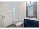 Modern bathroom featuring a glass shower, sleek vanity, and decorative tile work at 827 Placido Ne Way, St Petersburg, FL 33704