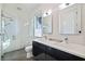 Modern bathroom with double sink vanity, sleek fixtures, frameless shower, and a window at 827 Placido Ne Way, St Petersburg, FL 33704