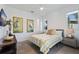 Bright bedroom with a patterned bedspread, neutral walls, and natural light from a window at 827 Placido Ne Way, St Petersburg, FL 33704