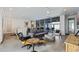 Open-concept living room with modern furnishings, tile floors, and seamless access to the outdoor patio at 827 Placido Ne Way, St Petersburg, FL 33704