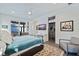 Bedroom featuring a cozy sitting area, large closet, and access to the outdoor area at 827 Placido Ne Way, St Petersburg, FL 33704