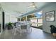 Covered patio features ample seating, ceiling fans, and views of the backyard pool area at 827 Placido Ne Way, St Petersburg, FL 33704