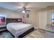 Bedroom features a neutral color scheme, ceiling fan, and plenty of space at 8289 136Th St, Seminole, FL 33776
