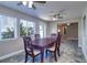 Spacious dining room with elegant wood table set and sunny window views at 8289 136Th St, Seminole, FL 33776