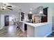 Open kitchen featuring modern countertops, bar seating, and stylish pendant lighting at 8289 136Th St, Seminole, FL 33776