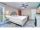 Cozy main bedroom features a comfortable bed, fireplace, and natural lighting at 8289 136Th St, Seminole, FL 33776