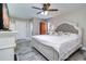 Cozy bedroom with a large bed, neutral tones, and ample closet space at 8289 136Th St, Seminole, FL 33776