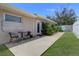 Outdoor patio area featuring a seating arrangement and garden at 8289 136Th St, Seminole, FL 33776
