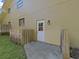 Backyard door that provides access to the home's outdoor area and backyard at 852 Village Way, Palm Harbor, FL 34683