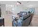 Open concept home features the living room with high ceilings, tile flooring and staircase in the background at 852 Village Way, Palm Harbor, FL 34683