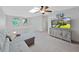 Bright living room with a gray sofa, TV, and modern decor at 852 Village Way, Palm Harbor, FL 34683