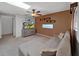 Inviting living room features a comfortable gray sofa, TV, and modern decor at 852 Village Way, Palm Harbor, FL 34683