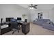 Spacious office area with a large desk, sofa, and ample space at 852 Village Way, Palm Harbor, FL 34683