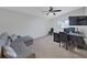 Bright office features a desk, comfortable sofa, and a window at 852 Village Way, Palm Harbor, FL 34683