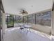 Enclosed patio offers an outdoor living area with great backyard views at 852 Village Way, Palm Harbor, FL 34683