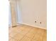 Bright bedroom with tile floors, baseboard trim, and minimalist design at 9481 Highland Oak Dr # 1101, Tampa, FL 33647