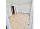 Open bedroom with neutral colors, tile flooring, closet, and lots of natural light at 9481 Highland Oak Dr # 1101, Tampa, FL 33647