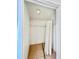 Empty walk-in closet features wire shelving, tile floor, and a light at 9481 Highland Oak Dr # 1101, Tampa, FL 33647