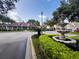 Community clubhouse featuring a fountain, beautiful landscaping, and ample parking at 9481 Highland Oak Dr # 1101, Tampa, FL 33647