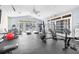 On-site gym with modern equipment, ceiling fans, and French doors for natural light at 9481 Highland Oak Dr # 1101, Tampa, FL 33647